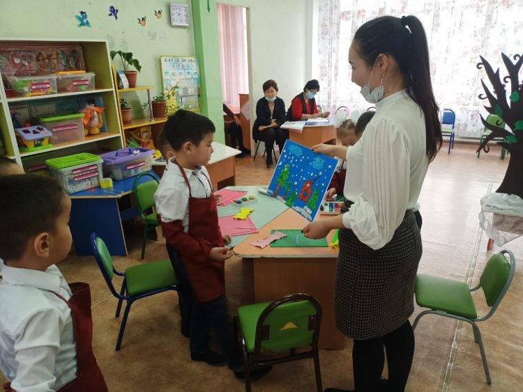 15 бөбекжай-бақша "Сиқырлы әлемге саяхат" тақырыбында ұйымдастырылған ашық оқу қызметі.